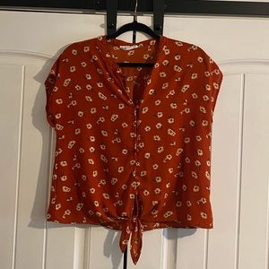 Burnt orange floral blouse